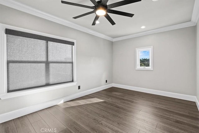 spare room with dark wood-type flooring, ceiling fan, and ornamental molding