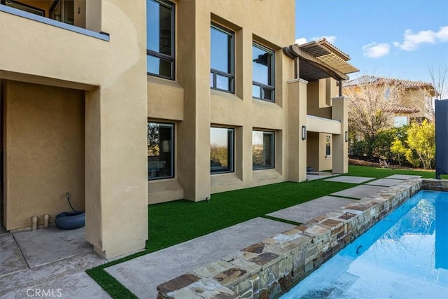 rear view of house with a yard