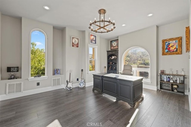 interior space featuring plenty of natural light, a chandelier, and dark hardwood / wood-style floors