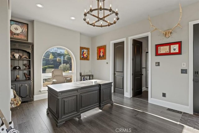 office area with dark hardwood / wood-style floors and a chandelier