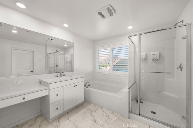 bathroom with independent shower and bath and vanity