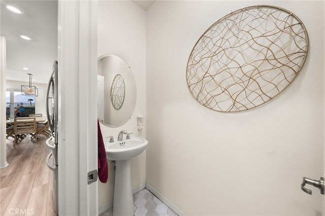 bathroom with wood-type flooring