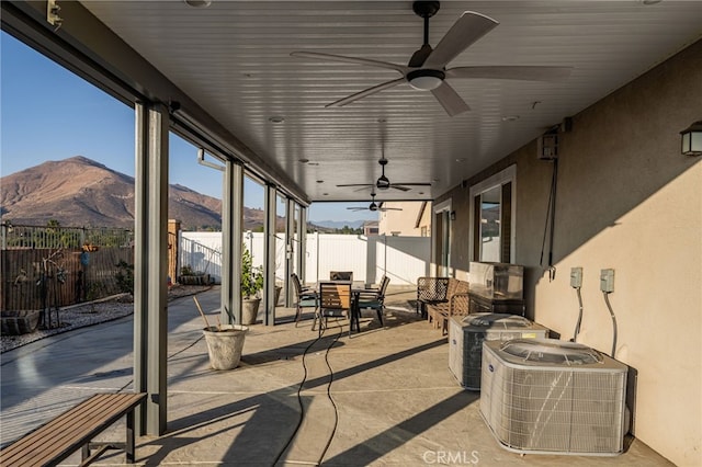 view of patio with central AC and a mountain view