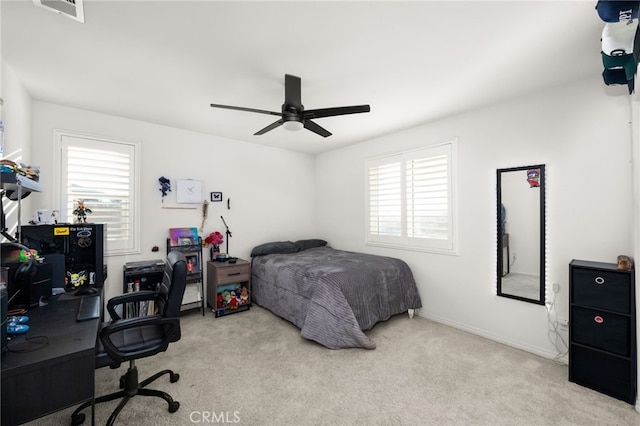 carpeted bedroom with ceiling fan