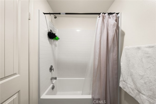 bathroom featuring shower / bathtub combination with curtain