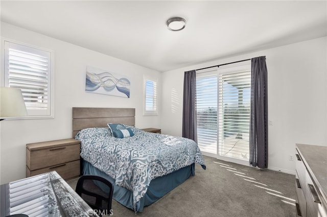 bedroom featuring dark colored carpet