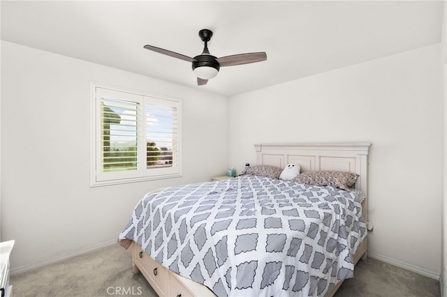 bedroom with ceiling fan and light carpet