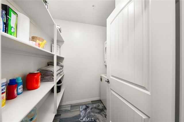 pantry with stacked washer and dryer