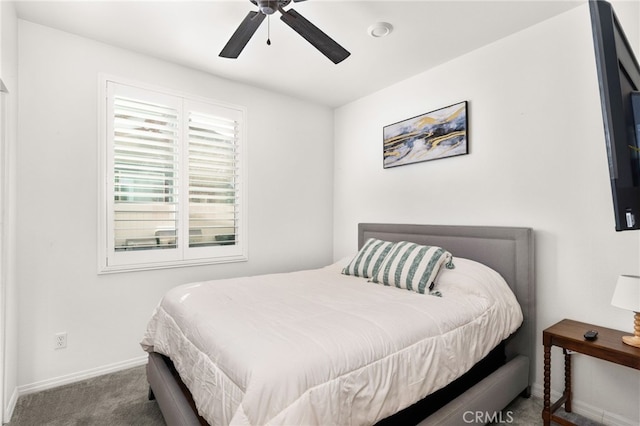 bedroom featuring ceiling fan and carpet