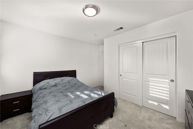 carpeted bedroom with a closet