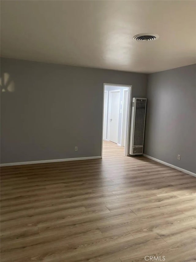 spare room with light wood-type flooring