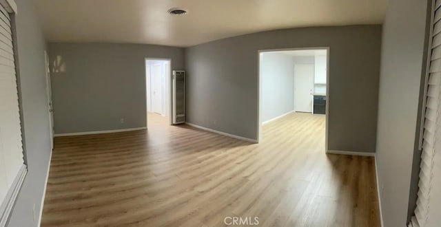 unfurnished room featuring light hardwood / wood-style floors