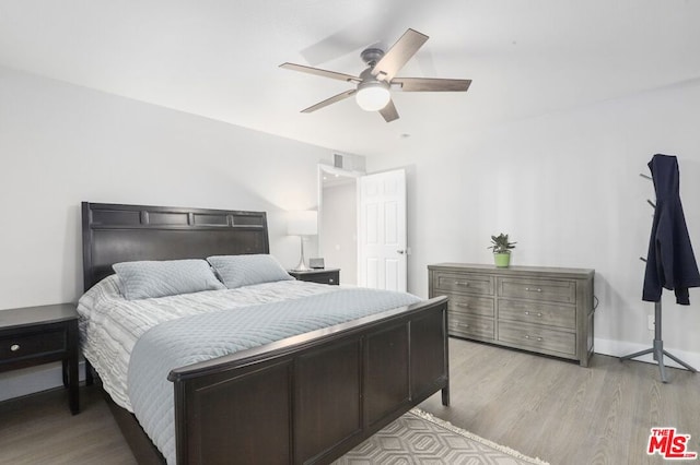 bedroom featuring ceiling fan and light wood-type flooring