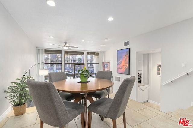 tiled dining room featuring ceiling fan