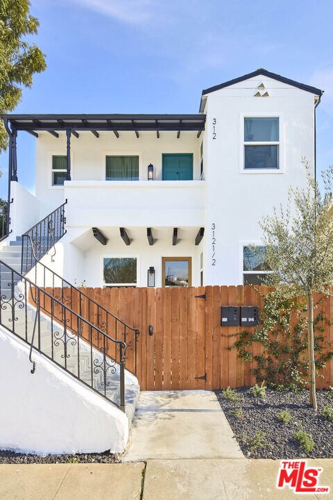 view of front of house featuring a balcony