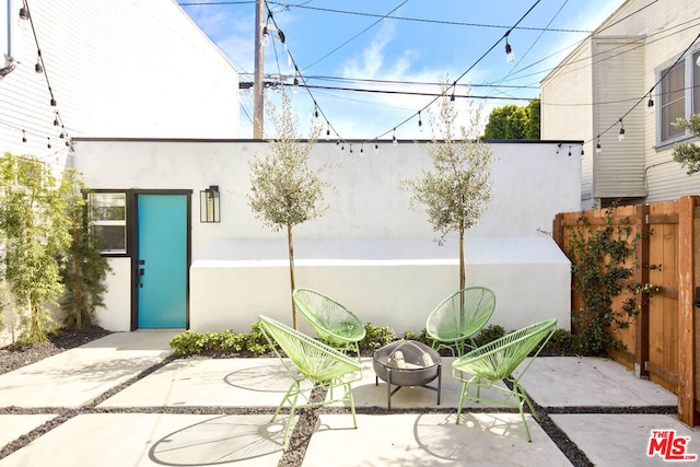 view of patio / terrace with a fire pit