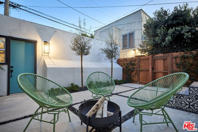 view of patio / terrace with an outdoor fire pit