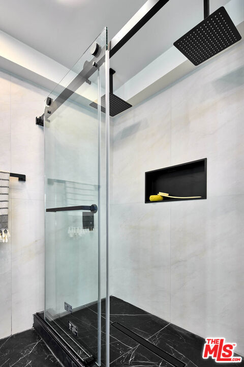 details with an enclosed shower