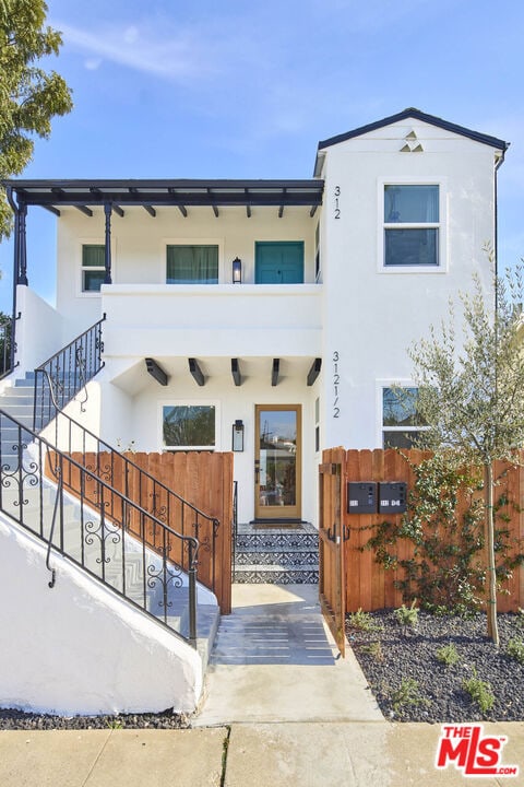 view of front of house with a balcony