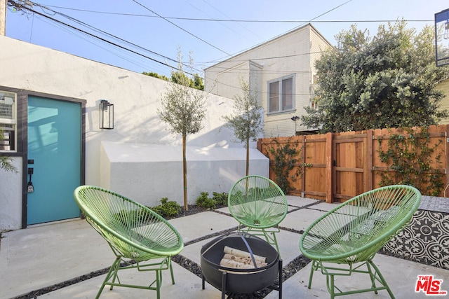 view of patio / terrace with a fire pit