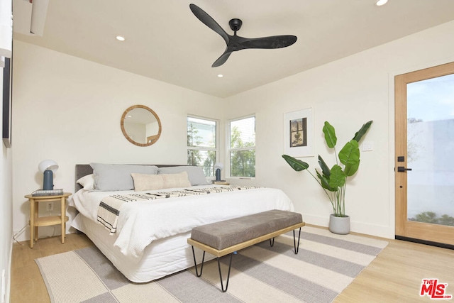 bedroom featuring ceiling fan and light hardwood / wood-style flooring