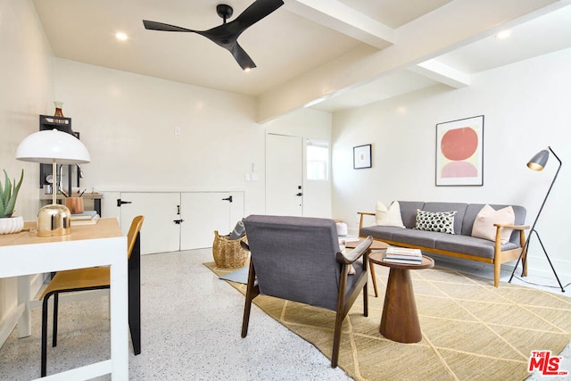 living room featuring ceiling fan and beamed ceiling