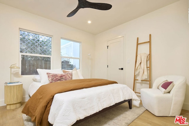 bedroom featuring ceiling fan and hardwood / wood-style floors