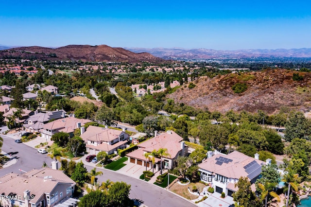 birds eye view of property featuring a mountain view