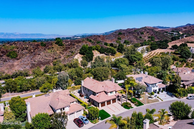 drone / aerial view featuring a mountain view