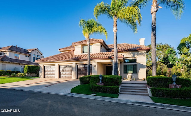 mediterranean / spanish-style house featuring a garage