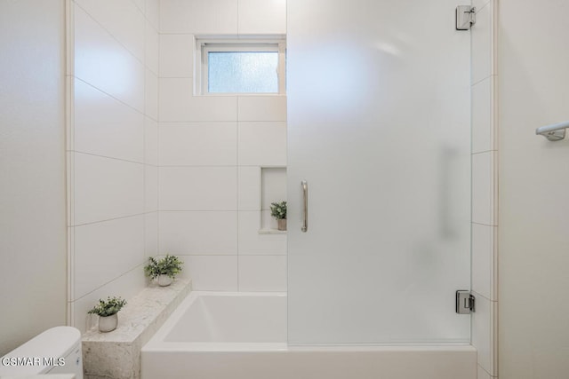 bathroom featuring toilet and separate shower and tub