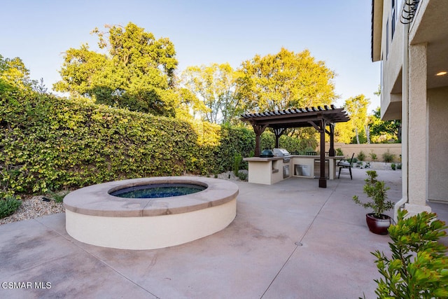 view of patio with a pergola and exterior kitchen