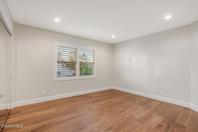 empty room featuring hardwood / wood-style flooring