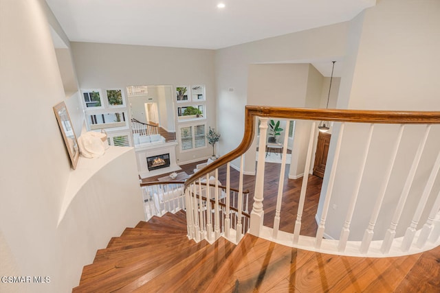 staircase featuring hardwood / wood-style flooring