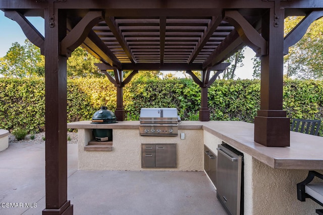 view of patio / terrace featuring exterior kitchen, a grill, and a pergola