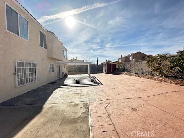 view of patio / terrace featuring a shed