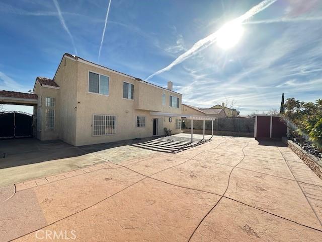 rear view of property with a patio area