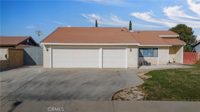 view of front of home with a garage and a front yard