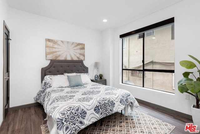 bedroom featuring dark hardwood / wood-style floors