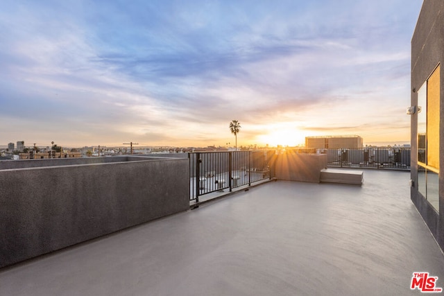 patio terrace at dusk with a balcony