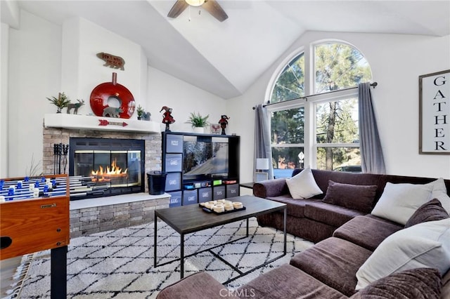 living room with ceiling fan and vaulted ceiling