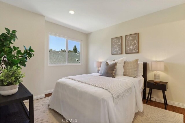 bedroom with light hardwood / wood-style floors