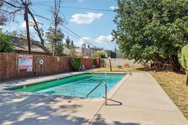 view of pool featuring a patio