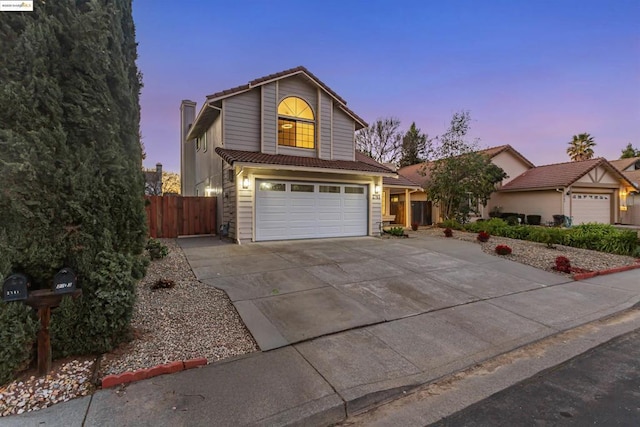 front of property with a garage