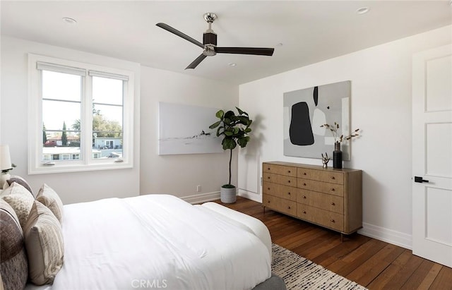 bedroom featuring ceiling fan and dark hardwood / wood-style flooring