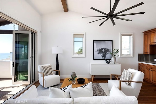 living room with a wealth of natural light, dark hardwood / wood-style floors, and vaulted ceiling with beams