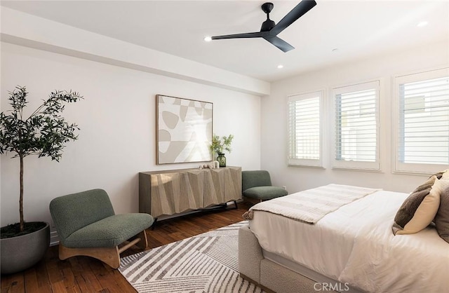 bedroom featuring ceiling fan and dark hardwood / wood-style floors