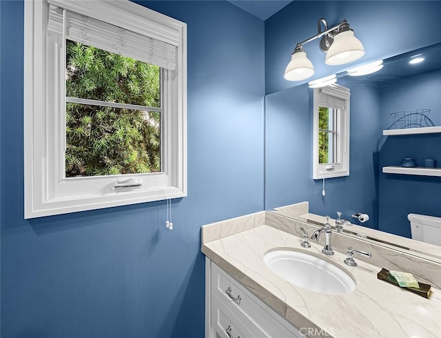 bathroom featuring plenty of natural light and vanity