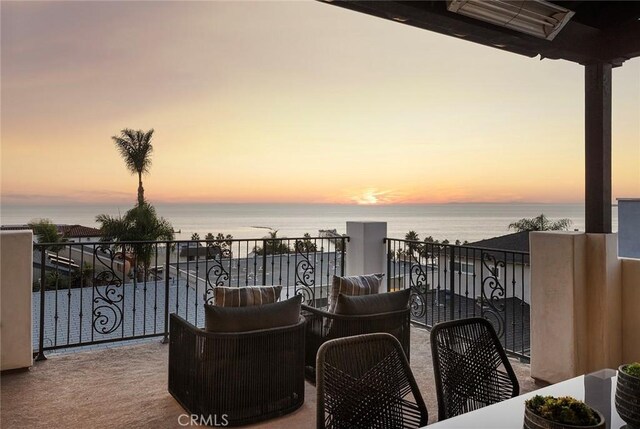 balcony at dusk with a water view