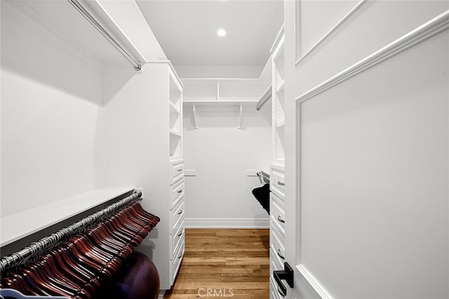 walk in closet featuring light hardwood / wood-style floors